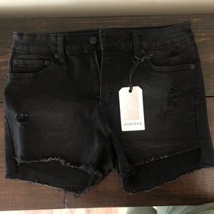 Distressed black jean shorts